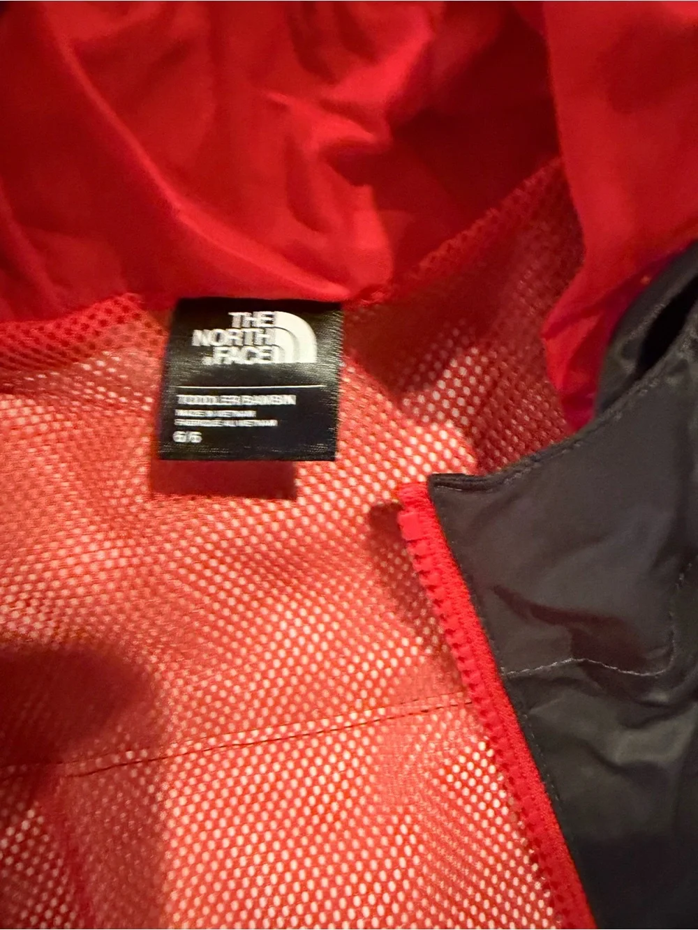 The North Face Kids' Gray Rain Jacket with Red Hood & Multicolor Print